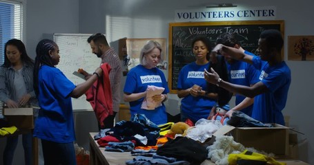 Volunteer team packing clothes