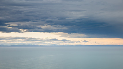 sea ocean and dark blue sky clouds