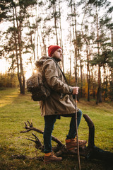 Young blogger photographer travel in mountain forest