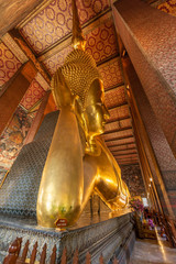 The Reclining Buddha at the Wat Arun Ratchawararam temple complex in the Bangkok.  The Buddha that...