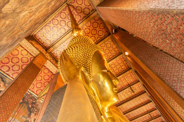 The Reclining Buddha at the Wat Arun Ratchawararam temple complex in the Bangkok.  The Buddha that...