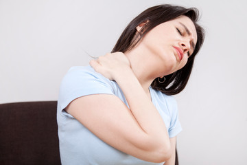 Fototapeta premium Young woman with neck pain