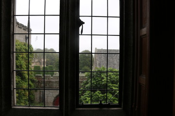 Tudor leaded window shot from inside an English manor house. A leaded window of  an English Tudor manor house taken from inside.