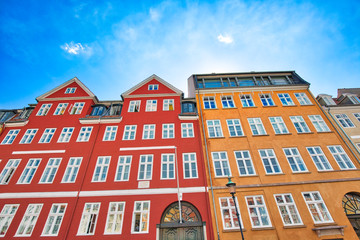 Fototapeta premium Copenhagen, Denmark-2 August, 2018: Famous Nyhavn (New Harbour) bay in Copenhagen, a historic 17 century European waterfront with colorful buildings. A starting point for boat and canal tours.