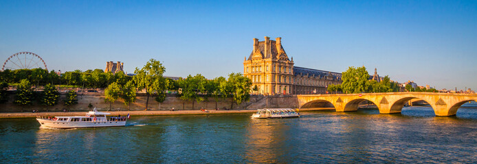 Sunset view on bridge and buildings on the Seine river in Paris, France.