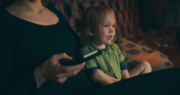 Mother using smartphone and ignoring toddler