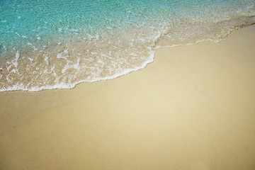 Fototapeta na wymiar Soft blue wave of the sea. Summer background.