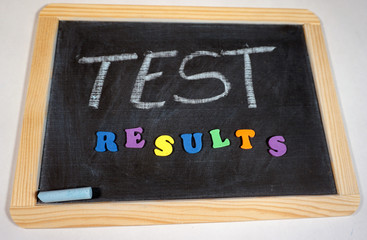 Test results message on chalkboard