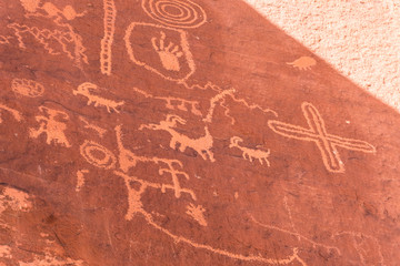 Petroglyphs carved into stone in Arches National Park.