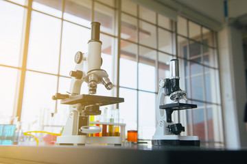 Picture of microscope with metal len for research and medical equipment in lab room