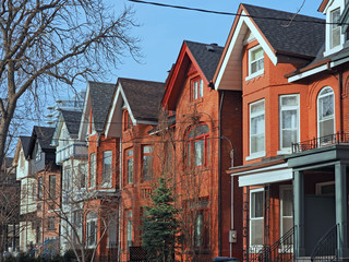 Row of old Victorian style brick houses with gables
