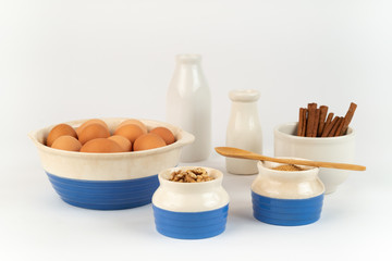 Farm Fresh Organic Free Range Eggs, Walnuts, Cinnamon, Organic Sugar in Blue and White Bowls. Farm to Table.