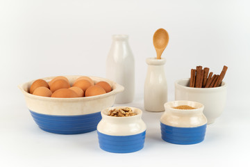 Farm Fresh Organic Free Range Eggs, Walnuts, Cinnamon, Organic Sugar in Blue and White Bowls. Farm to Table.