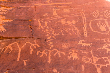 Petroglyphs carved into stone in Arches National Park.