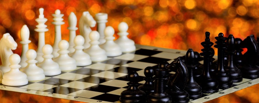 Chess on the chessboard, competition and winning strategy. Chess is a popular ancient Board logic antagonistic game with special black and white pieces, on a cell Board for two intelligent rivals.