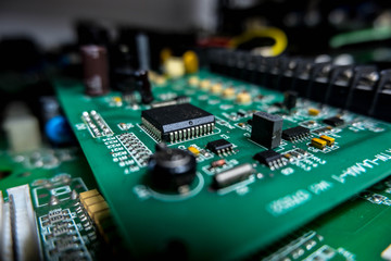 Fototapeta na wymiar SMD IC Electronics component on green PCB Board