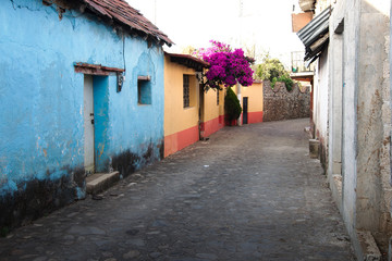 Fototapeta na wymiar A typical cobblestone street at the town center, Huasca de Ocampo, Hidalgo, Mexico.
