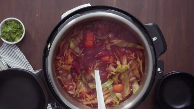 Time lapse. Step by step. Flat lay. Cooking beet soup, borscht with organic vegetables in multicooker.