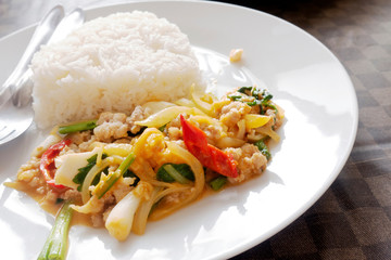 Stir-fried pork, egg yolk and rice