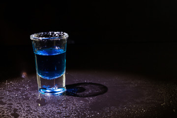 Whiskey in glass shots  on black background.