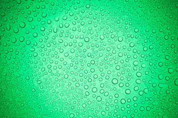 Rain droplets on green glass background, Water drops on glass.
