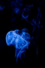 Blue toxic fumes movement on a black background.