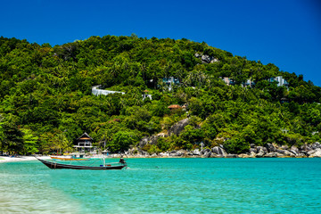 Longboats on the Coast of Ko Phagnan Island in Thailand