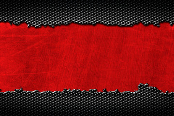 black metal carbon fiber on red metal plate.