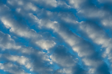 background texture of blue sky near dusk with heavy cloud in some pattern