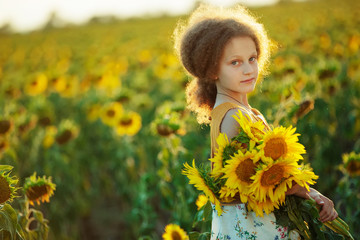 Child in sunflowers