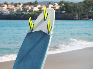Close-up of a surfboard near the ocean.