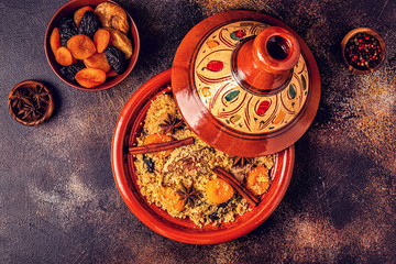Traditional moroccan tajine of chicken with dried fruits and spices.