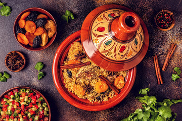 Traditional moroccan tajine of chicken with dried fruits and spices.