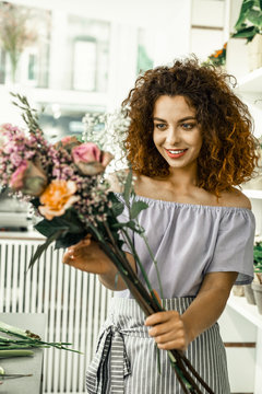 Young Student Loving Her First Job While Working In Floral Shop