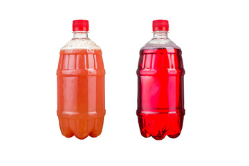 Two plastic bottles with colorful natural juices. Isolated.