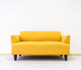 Yellow modern comfortable sofa in living room apartment with white wall.Furniture decorate design...
