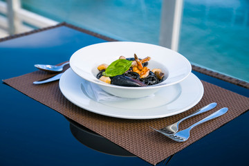 Spagetti with seafood on a plate.