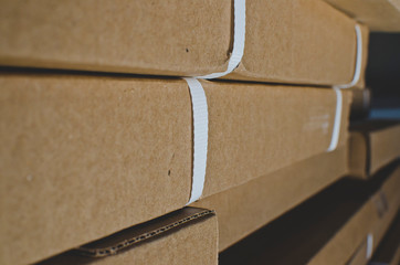 A view of the close up straps and texture on the boxed items in the back warehouse. 