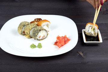 Sushi rolls on a white plate