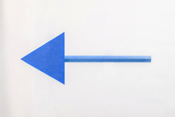 BLUE wooden arrow to the left.
