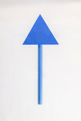 BLUE wooden arrow pointing upwards.
