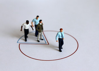 Fototapeta premium Miniature people standing on a circle graph.