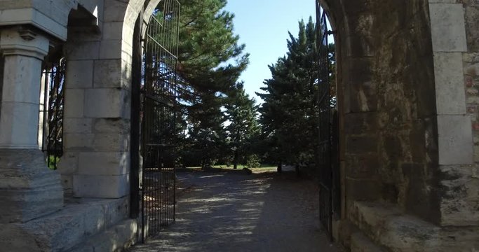 View of the southern garden of the Buda Castle through the gate in daytime.