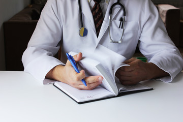 Doctor consulting patient hands closeup. Patient sitting at doctor office. Diagnostic prevention of...