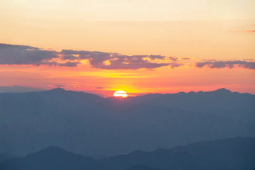 Fototapeta na wymiar Sunrise behind the mountain