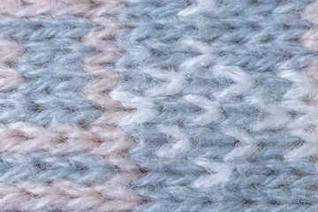 Knitted texture close-up, visible threads and fibers. The image is suitable as a background for various tasks.