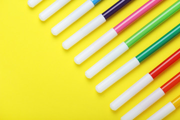 Multicolored markers at bright background