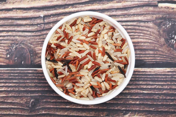 A mixture of brown, white, and red indica rice