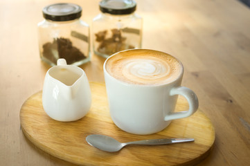 Obraz na płótnie Canvas Coffee with syrup on wooden table.