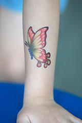 Butterfly Sticker on child hand, Dress up tattoo